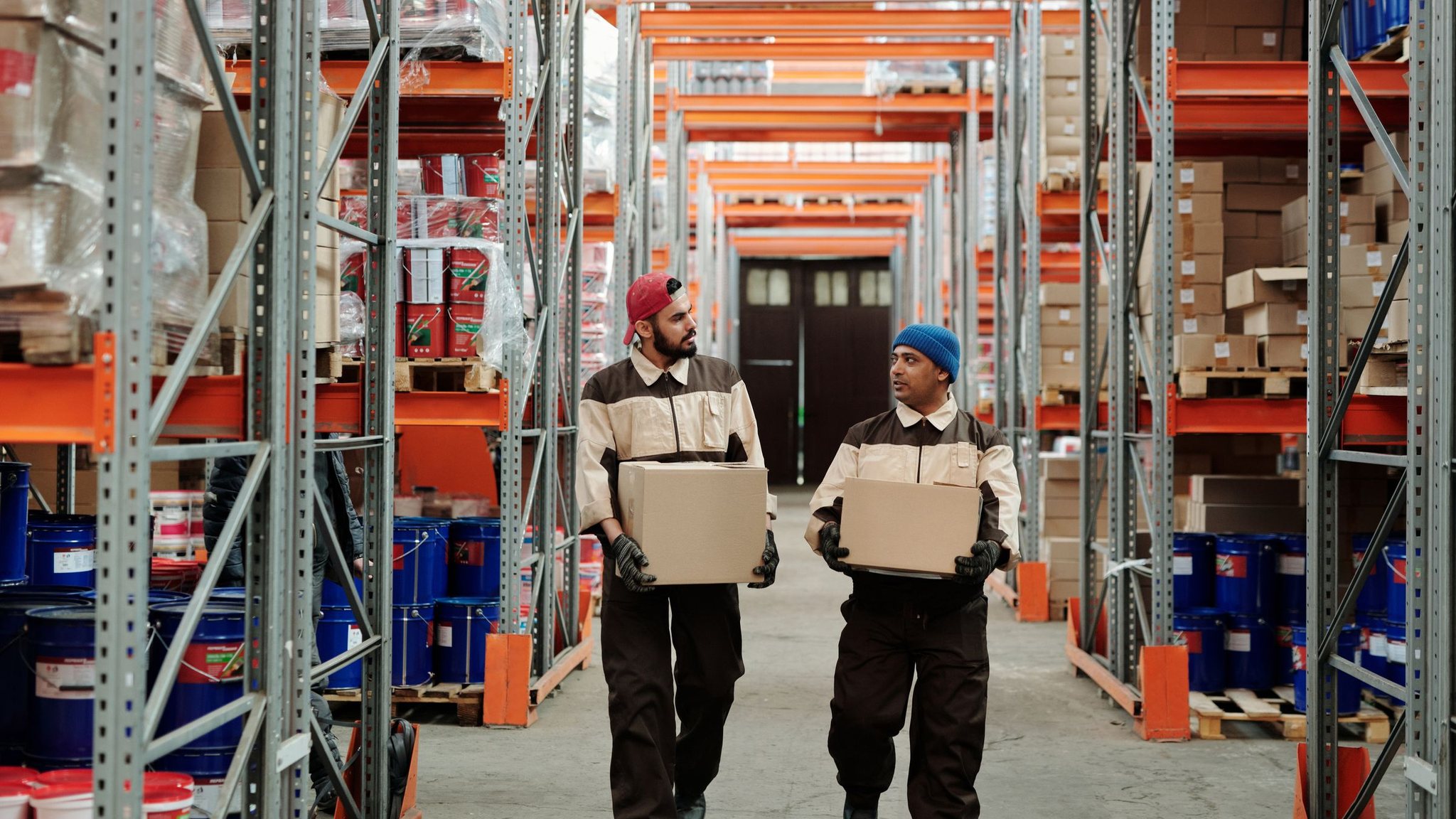 Warehouse team carrying boxes
